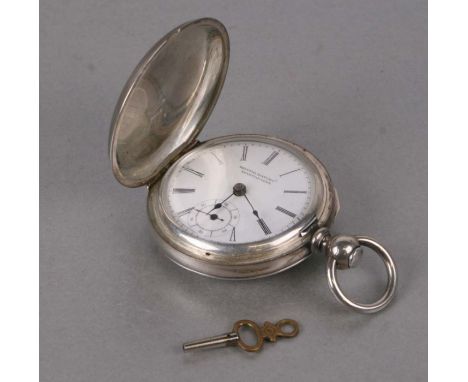 A white metal cased key wound full hunter pocket watch, the white enamel dial with Roman numerals and subsidiary seconds dial