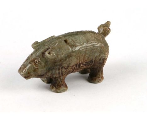 A Chinese celadon and russet jade pig, 7cms long.