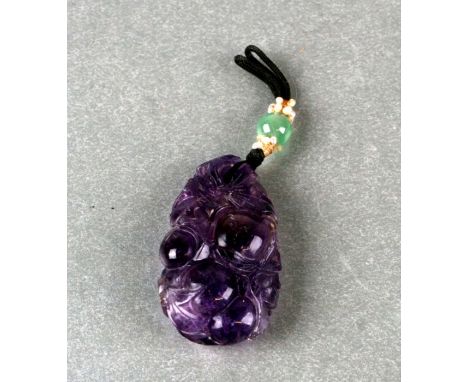 A Chinese carved amethyst hair ornament or pendant in the form of fruit and foliage, 4.5cms high.Condition ReportThere are so
