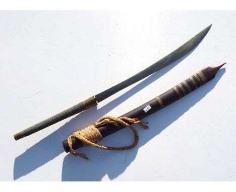 A Burmese Dha sword with wire wrapped grip in a brass banded hardwood scabbard, 80cms log.