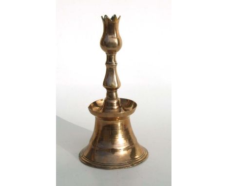 A 17th / 18th Turkish Ottoman brass tulip candlestick, 29cms high. 