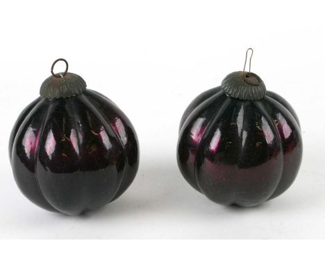 Two large Victorian style amethyst glass Christmas tree baubles, 11cms high (2).Condition Reportupon closer inspection we bel
