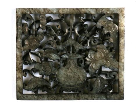 A Chines figured jade / hardstone pierced panel depicting a central vase amongst flowering foliage and a bat, 7 by 6cms.