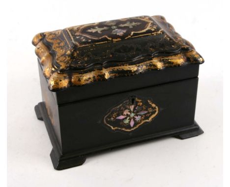 A 19th papier mache tea caddy with tortoiseshell inlay. Width 21cms (8.25ins) by 14cms (5.5ins) high