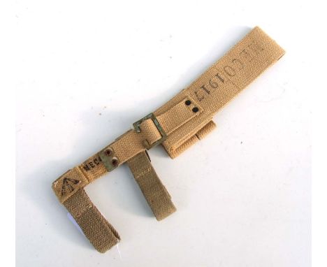 An unissued 08 Pattern bayonet frog with helve strap and carrier. Marked to the reverse of the frog with the War Department a