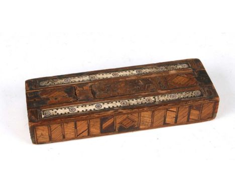 A Napoleonic Prisoner of War games box with cribbage board top containing bone dominoes, 21cms long.