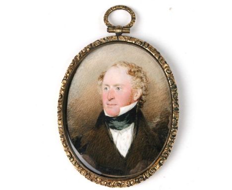 A Regency period oval bust portrait miniature depicting a gentleman, watercolour on ivory, in a gilt metal frame, 5 by 7cms.