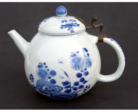 A Chinese blue &amp; white teapot of globular form decorated with a prunus tree with later European applied thumb piece hinge