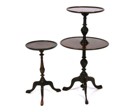 A two-tier mahogany wine table on turned column and tripod base; together with a similar smaller (2).Condition ReportTwo tier