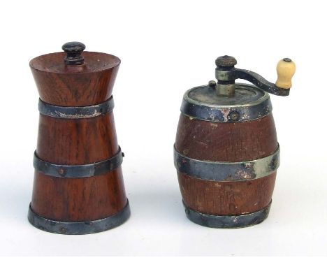 A Peugeot Freres oak pepper grinder in the form of a milk churn; together with another similar in the form of a barrel, both 
