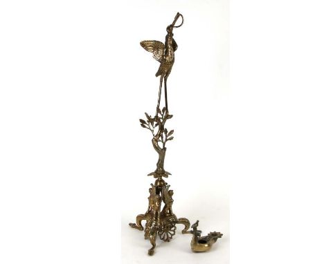 A gilt metal Roman oil lamp stand in the form of a stork with a snake in its beak, on a naturalistic column with three sphinx