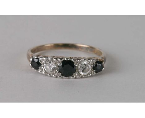 A silver gilt five-stone sapphire and white stone ring, approx. UK size 'S'.