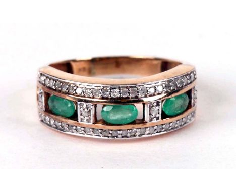 A 9ct gold diamond and emerald ring, approx UK size 'R', 3.6g.