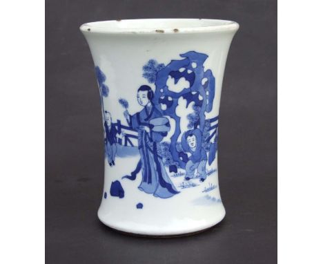 A Chinese Kangxi blue &amp; white brush pot of waisted cylindrical form decorated with a lady playing with children in a gard