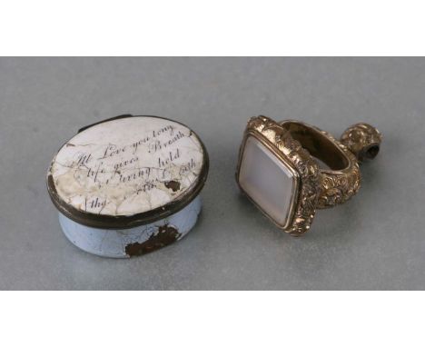A 19th century oval Bilston enamel patch box, the cover painted with a verse (a/f), 3.5cms wide; together with a gilt metal h