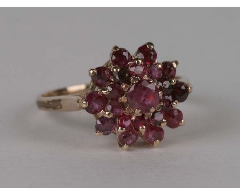 A 9ct gold and ruby cluster ring, 3.1g, approx UK size 'R'.Condition ReportFull English hallmarks