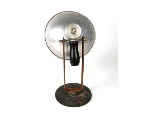 A vintage industrial adjustable lamp with aluminium shade, on a cast iron base stamped 'Commercial', 36cms high.