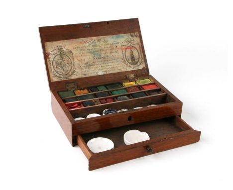 A late 19th / early 20th century Reeves mahogany artist's box containing paint cakes impressed Windsor &amp; Newton, and cera