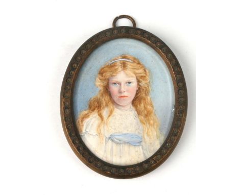 A Victorian oval bust portrait miniature of a young girl, watercolour on ivory, in a brass oval frame, 5.5 by 6cms.