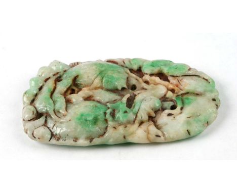 A Chinese pierced jade / hardstone pendant carved with a dragon, a fish and a bat, 11cms high.