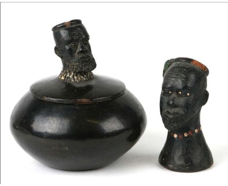 A Zulu terracotta box and cover, the cover with Zulu chief finial, 11cms diameter; together with a similar terracotta bust of