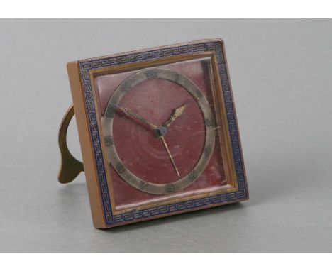 An Art Deco travel alarm clock with enamel decoration, the silver dial with Arabic numerals, 8cms wide.