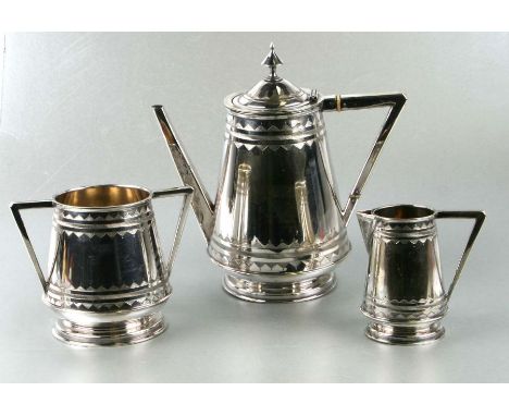 A Victorian Aesthetic Movement silver plated tea set, the teapot 24cms high.