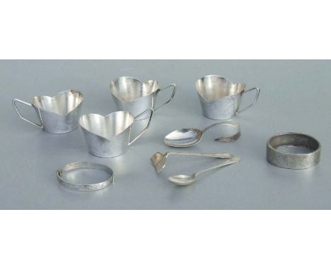 Two silver bangles; a silver caddy spoon; together with four white metal cups; and other items.