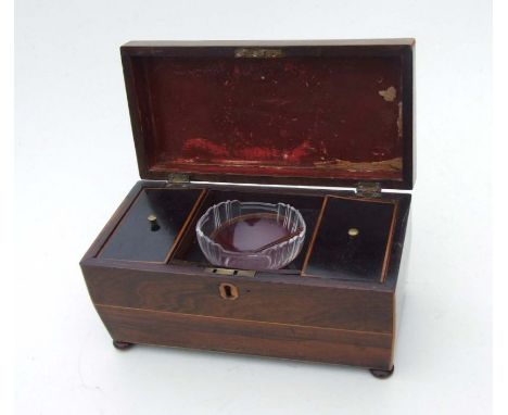 A 19th century rosewood tea caddy with fitted interior of two tea cannisters and glass mixing bowl, 30cms wide.