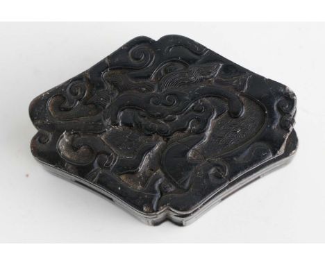 A Chinese Kangxi period carved soapstone seal paste box and cover decorated with a stylised dragon, 8cms wide. (Similar examp