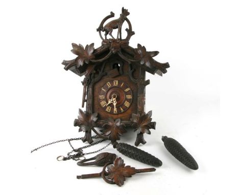 A Black Forest cuckoo clock, 36cms wide.