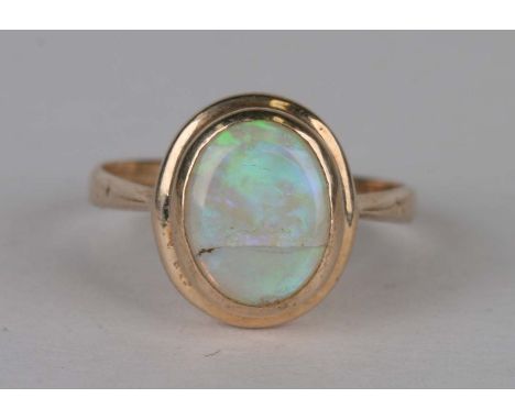 A 9ct gold and opal dress ring, weight 2g, approx UK size 'K'.