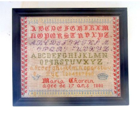 A late 19th century French needlework sampler, Maria Chorein aged 17 and dated 1881, with alphabet within a scrolling foliate