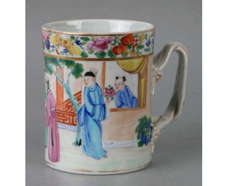 A mid 19th century Chinese Canton porcelain mug decorated with figures examining a scroll, 11cms high.Condition ReportGilt ru