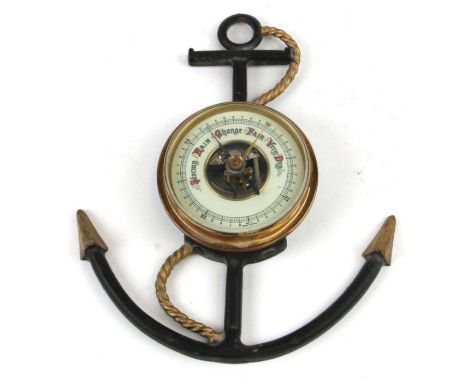 A West German nautical themed wall barometer, overall 23cms high.