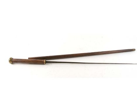 A hardwood sword stick (possibly palm wood) with square section steel blade marked 'LP', blade length 66cms, overall 92cms.