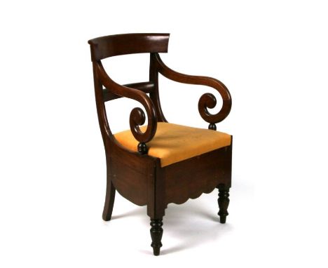 A 19th century mahogany commode chair.