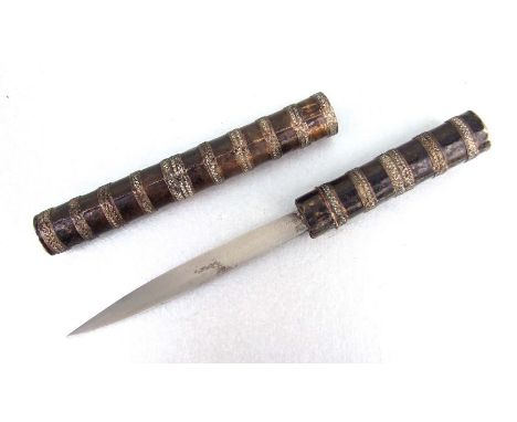 A Burmese dagger in its ornate scabbard. Blade length 12.5cms (5ins)