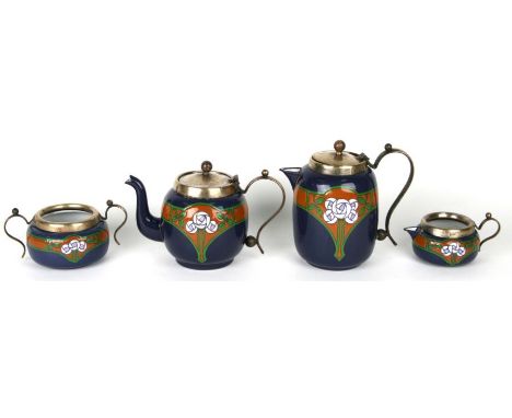 An Art Nouveau four-piece enamel tea and coffee set decorated with McIntosh design of roses with silver plated handles and co