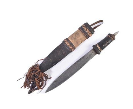 A 19th Century Sudanese leather clad double edged tribal dagger / knife. Housed within its original leather and hide scabbard