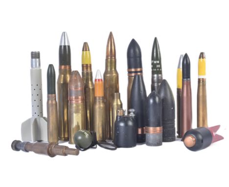 A collection of assorted First, Second and postwar artillery shell cases and projectiles. Examples to include; 30mm RG78 prac
