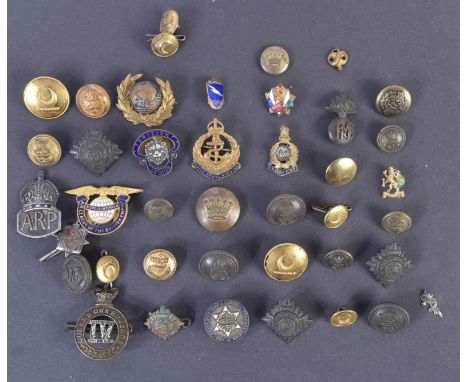 A collection of assorted 20th Century (WWII and surrounding period) military related buttons, badges and cap badges. Includes