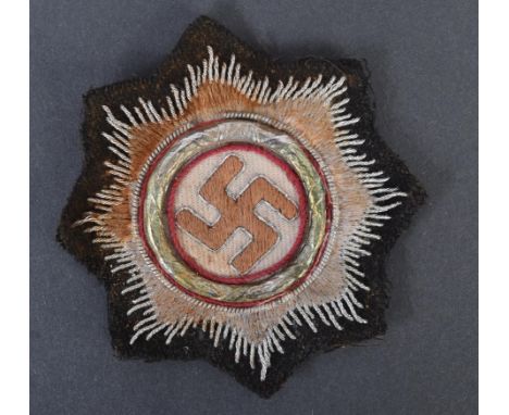 A WWII Second World War Third Reich Nazi German ' Deutsches Kruez ' ( The German Cross ) medal patch. The German Cross being 