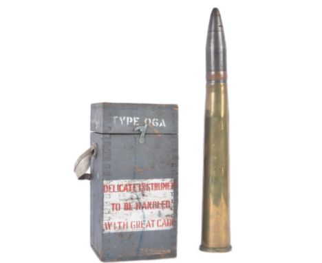 A WWII Second World War British 40mm Bofors artillery shell dated 1940 with projectile head and fuse and an RAF Royal Air For