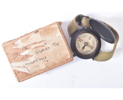 A WWII Second World War British SOE Special Operations Executive / British Commandos wrist compass. The compass within a blac