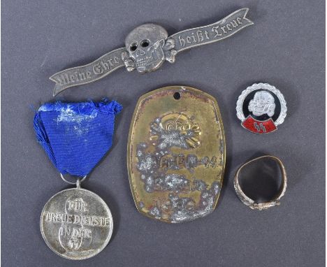 A collection of assorted WWII Second World Third Reich Nazi German style badges, medals and other items to comprising a brass
