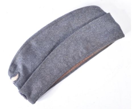 A WWII Second World War Third Reich Nazi German Luftwaffe enlisted mans / NCO's side cap. The cap with embroidered roundel an