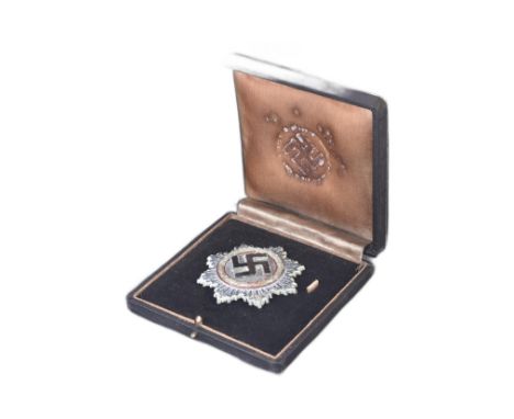 A WWII Second World War Third Reich Nazi German ' Deutsches Kruez ' ( The German Cross ) medal. The German Cross being a (fad