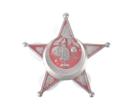 An original WWI First World War Turkish / Ottoman Empire Gallipoli Star medal. Star shaped badge with a the remains of a red 