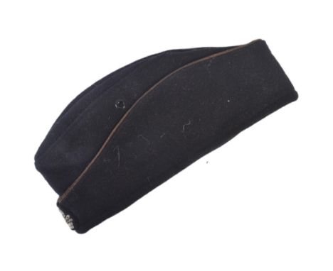 A WWII Second World War Third Reich Nazi German SS Panzer Officers side cap. The cap with embroidered SS Death Skull patch. B